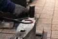 Making the horseshoe from heated red rod Royalty Free Stock Photo
