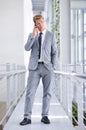 Making an important business call. A young and handsome employee using his mobile phone. Royalty Free Stock Photo