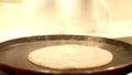 Making of Indian style wheat traditional dosa in a hot an using wheat flour macro