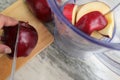 Making juice with apple fruit, blender top view. Royalty Free Stock Photo