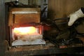Making the knife out of metal at the forge. Heating of metal billets in the furnace.