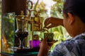Making legendary coffee, Kopi Luwak, in a vintage syphon. Bali, Indonesia