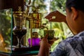 Making legendary coffee, Kopi Luwak, in a vintage syphon. Bali, Indonesia