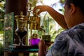 Making legendary coffee, Kopi Luwak, in a vintage syphon. Bali, Indonesia