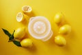 Lemons with lemon squeezer against a yellow background