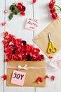 Making love message with envelope and rose petals Royalty Free Stock Photo