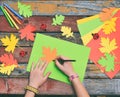 Making maple leaf from colored paper with your own hands for decoration of greeting card. Handmade crafts. Hello Autumn concept. C Royalty Free Stock Photo