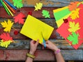 Making maple leaf from colored paper with your own hands for decoration of greeting card. Handmade crafts. Hello Autumn concept. C