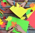 Making maple leaf from colored paper with your own hands for decoration of greeting card. Handmade crafts. Hello Autumn concept. C