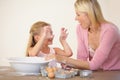 Making a marvelous mess with mum. A mother and daughter bonding while baking together. Royalty Free Stock Photo