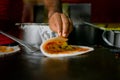 Making of masala dosa on the pan. Masala dosai or masale dose or masaldosa is a variation of the popular South Indian dosa. Used Royalty Free Stock Photo