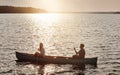 Making memories on the lake. a young couple rowing a boat out on the lake. Royalty Free Stock Photo