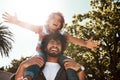 Making memories that theyll cherish for life. a father giving his little son a piggyback ride outdoors. Royalty Free Stock Photo