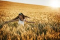 Making memories to last a lifetime. Shot of a cute little girl twirling in a cornfield. Royalty Free Stock Photo