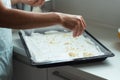 Making meringue layer with almond flakes for meringue roll