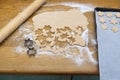 Making a mess of baking star shaped Christmas cookies - with rol Royalty Free Stock Photo