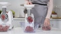 Making minced meat in electric meat grinders from fresh beef at home. Pile of chopped meat. Electric mincer machine with Royalty Free Stock Photo