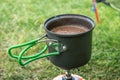 Making morning coffee in tent while hiking in Iceland Royalty Free Stock Photo