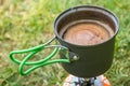 Making morning coffee in tent while hiking in Iceland Royalty Free Stock Photo