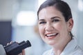 Making the most of her equipment. a young female lab tech using her microscope. Royalty Free Stock Photo