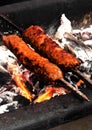 Making mutton kababs or kebabs on coal fired arrangement Royalty Free Stock Photo