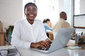 Making my dreams come true. a young businesswoman using a headset and laptop in a modern office. Royalty Free Stock Photo