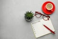 Making new year`s resolutions. Flat lay composition with notebook on light grey table Royalty Free Stock Photo
