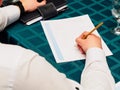 Making notes. Close-up of man in formalwear writing something Royalty Free Stock Photo