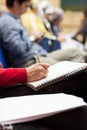 Making notes at conference, detail. Royalty Free Stock Photo