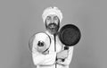 Making nutritional choice. Bearded man cooking in kitchen. culinary and cuisine. Kitchen utensils. Healthy food cooking