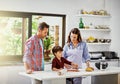 Making our favorite meal together. a young family making pizza together. Royalty Free Stock Photo