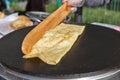 Making pancake with filling on frying electric stove