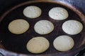 Making pancakes on frying pan top view Royalty Free Stock Photo