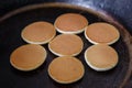 Making pancakes on frying pan top view Royalty Free Stock Photo