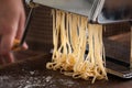 Making pasta with traditional machine Royalty Free Stock Photo