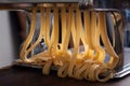 Making pasta with traditional machine Royalty Free Stock Photo