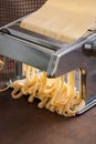 Making pasta with traditional machine Royalty Free Stock Photo