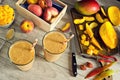 Making Peach Mango Smoothies with Sliced Fruit Royalty Free Stock Photo