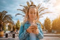 Making picture. Pretty female taking fun self portrait photo. Happy young girl with phone smile, typing texting and