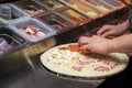 Making pizza at kitchen of pizzeria Royalty Free Stock Photo