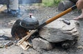 Making popcorn above a campfire