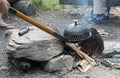 making popcorn above a campfire