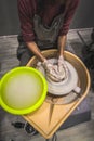 Making pottery by hand to make a container. woman hands close up, the masterful studio of ceramics works with clay on a potter Royalty Free Stock Photo