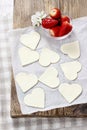 Making puff pastry cookies in heart shape filled with strawberries. Royalty Free Stock Photo