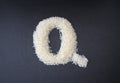 Making the Q capital letter by formed rice seeds