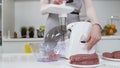 Making raw mincemeat with meat mincer at home. Pile of chopped meat. Electric mincer machine with fresh chopped meat Royalty Free Stock Photo