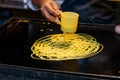 Making of a `roti jala` in Malaysia