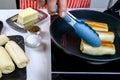 Making ruddy pancakes in domestic kitchen, cakes fried in frying pan. Preparation delicious healthy breakfast. Medium plan