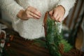 Making rustic christmas wreath, holiday advent