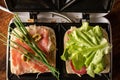 Making sandwiches from ham, vegetables and cheese in a sandwich maker. Two toasts with different fillings close-up Royalty Free Stock Photo